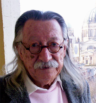 Joseph Weizenbaum, an older man with a white beard and glasses.